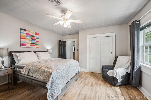 606 Goingsnake St, Tahlequah, OK 74464 - bedroom with wood finished floors, a closet, and a ceiling fan