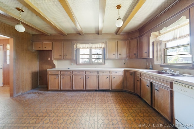 522 E 6th St, Claremore, OK 74017 - kitchen with dishwasher, beamed ceiling, light countertops, plenty of natural light, and wooden walls
