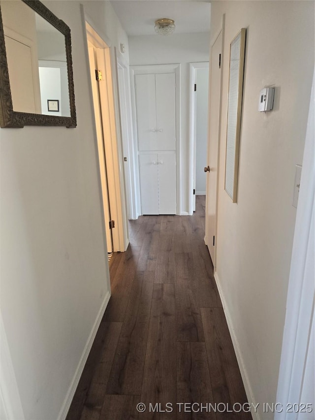 6920 E 20th St, Tulsa, OK 74112 - hall featuring dark wood-type flooring and baseboards