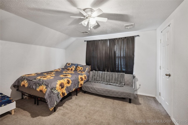 1105 S Maple Ave, Tahlequah, OK 74464 - carpeted bedroom with lofted ceiling, a ceiling fan, and a textured ceiling