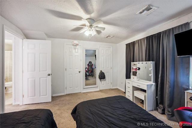 1105 S Maple Ave, Tahlequah, OK 74464 - bedroom featuring light colored carpet, a textured ceiling, and a ceiling fan