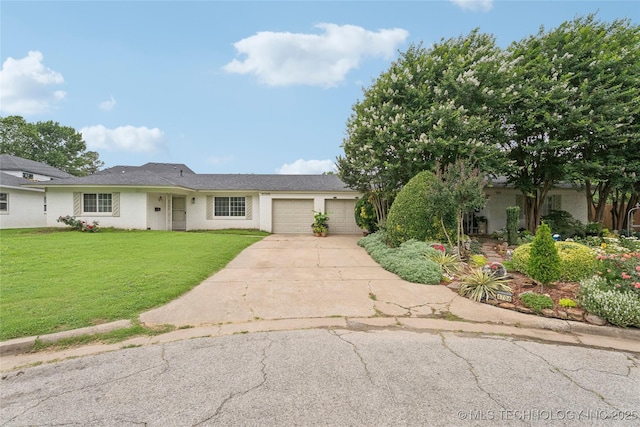 4707 S Madison Ave, Tulsa, OK 74105 - view of front of home with a garage, concrete driveway, and a front lawn