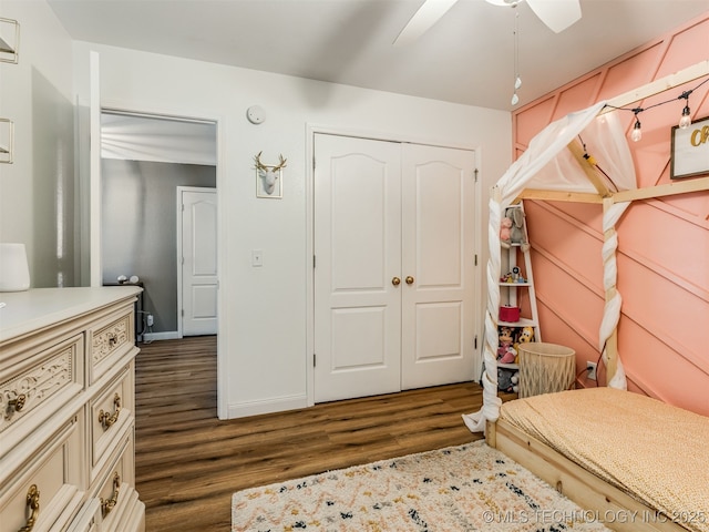1604 W Los Angeles Cir, Broken Arrow, OK 74011 - bedroom with dark wood-style floors, a closet, and a ceiling fan