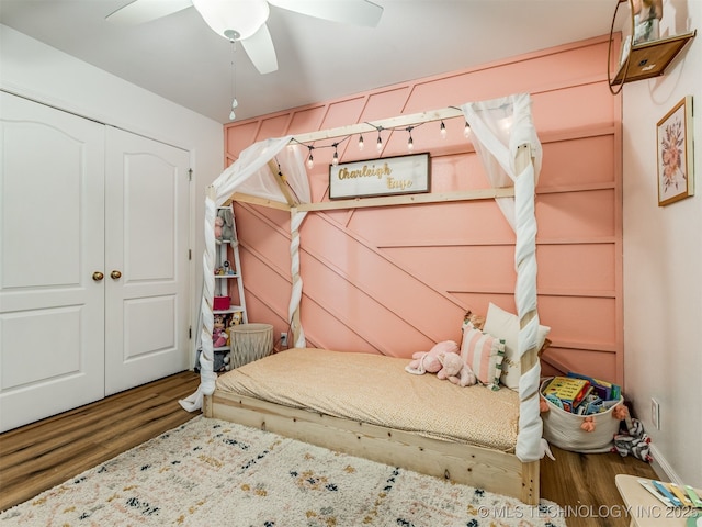 1604 W Los Angeles Cir, Broken Arrow, OK 74011 - bedroom featuring wood finished floors, a closet, and a ceiling fan