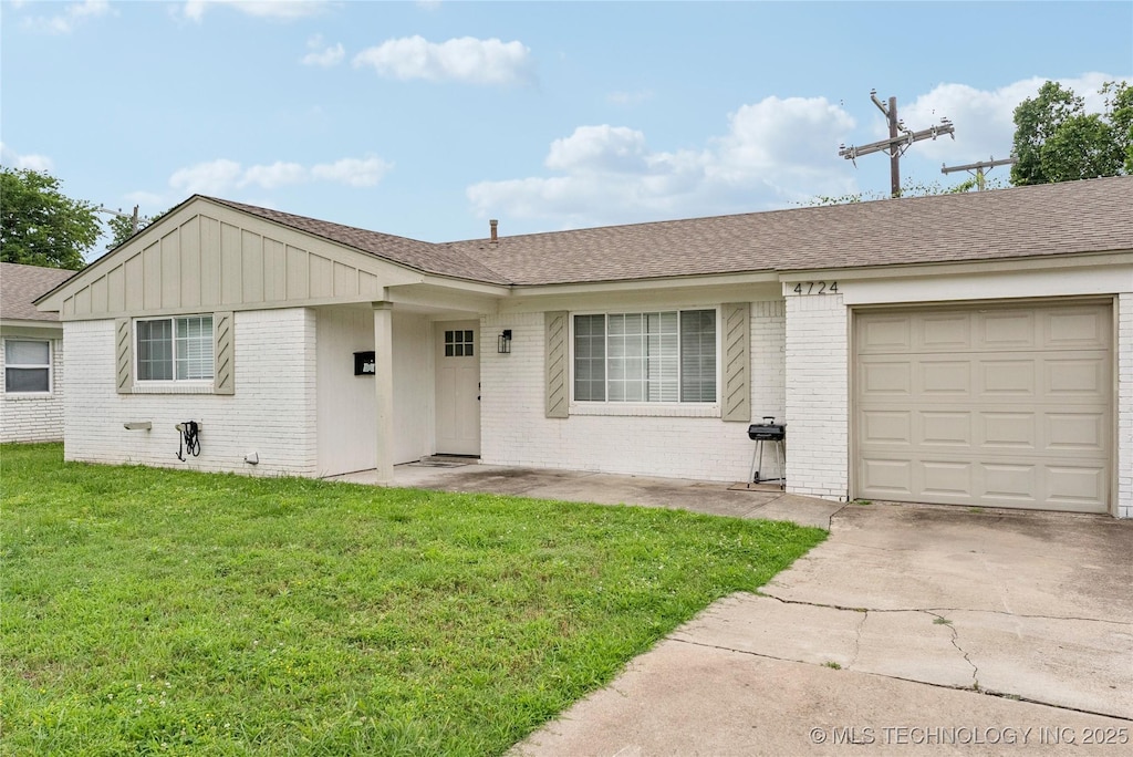 4722 S Madison Ave, Tulsa, OK 74105 - ranch-style home featuring brick siding, a front lawn, driveway, and a garage