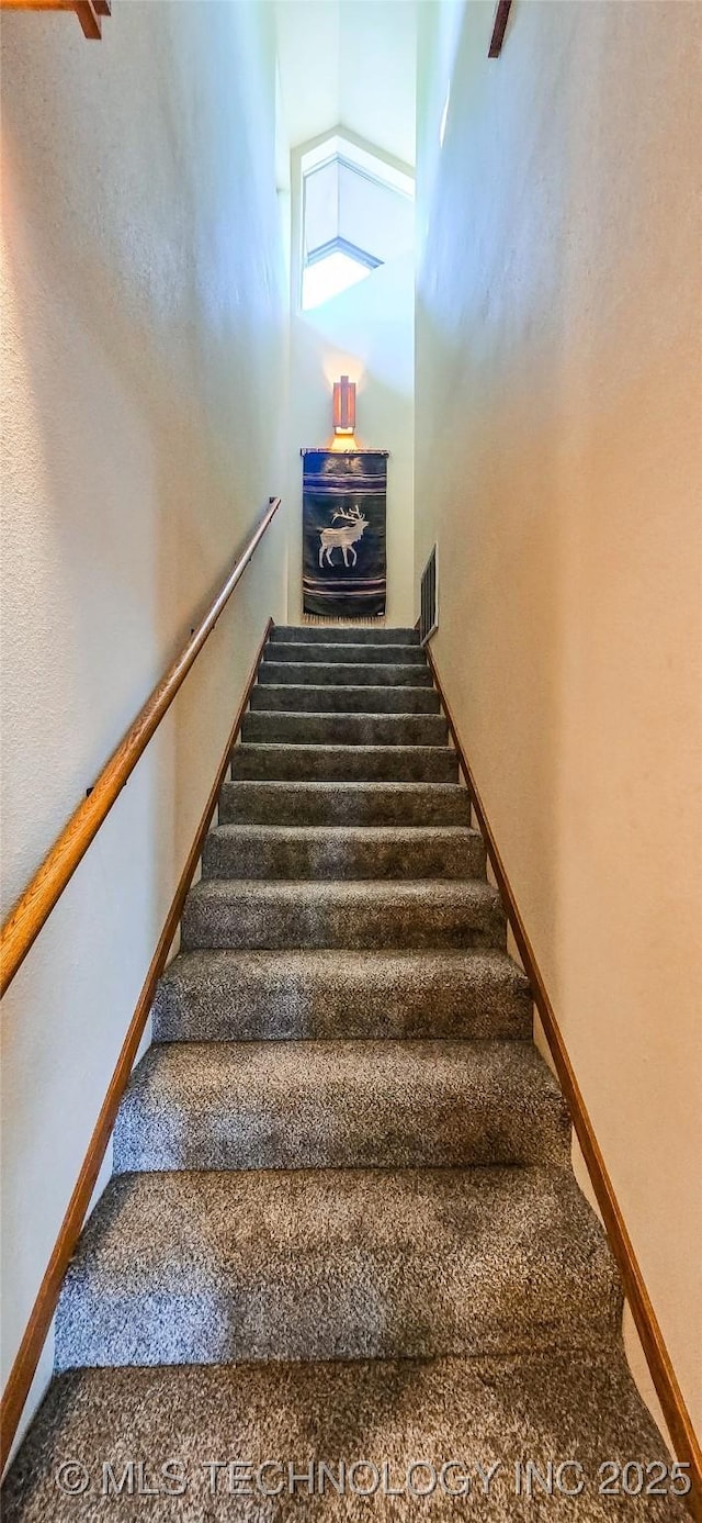 117189 S 4238th Rd, Eufaula, OK 74432 - staircase featuring a towering ceiling and carpet