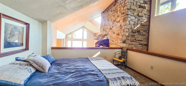 117189 S 4238th Rd, Eufaula, OK 74432 - bedroom with carpet flooring, a textured ceiling, and vaulted ceiling