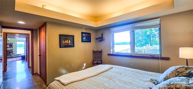 117189 S 4238th Rd, Eufaula, OK 74432 - bedroom with a tray ceiling, finished concrete flooring, and recessed lighting