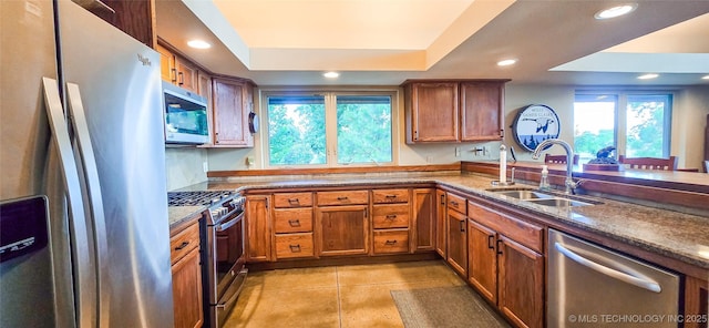 117189 S 4238th Rd, Eufaula, OK 74432 - kitchen featuring stainless steel appliances, plenty of natural light, recessed lighting, a raised ceiling, and brown cabinetry