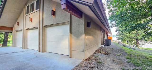 117189 S 4238th Rd, Eufaula, OK 74432 - view of home's exterior featuring an attached garage, stucco siding, and concrete driveway