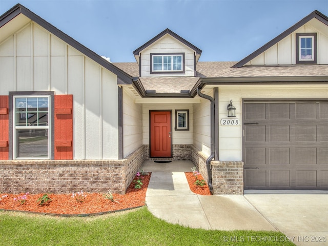 2008 E Union St, Broken Arrow, OK 74011 - view of front of property featuring a shingled roof, board and batten siding, an attached garage, and brick siding