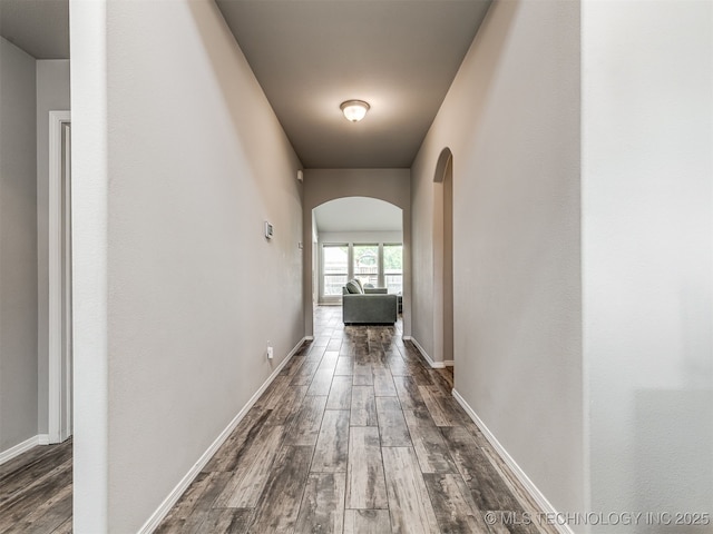 2008 E Union St, Broken Arrow, OK 74011 - hallway featuring arched walkways and dark wood-style flooring