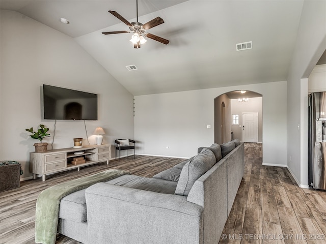 2008 E Union St, Broken Arrow, OK 74011 - living room featuring arched walkways, ceiling fan, wood finished floors, and high vaulted ceiling