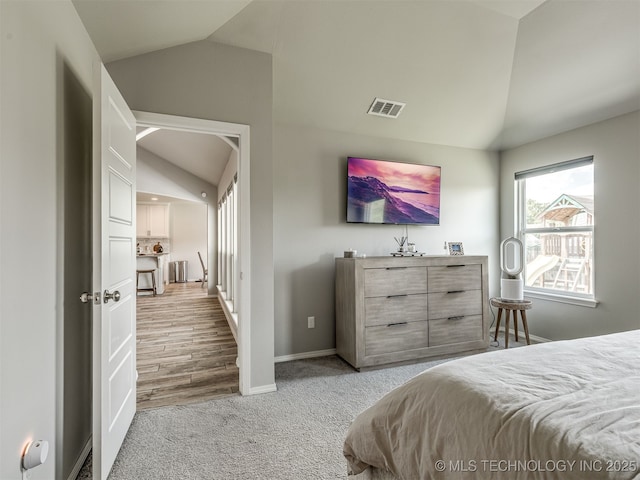 2008 E Union St, Broken Arrow, OK 74011 - carpeted bedroom featuring vaulted ceiling and baseboards