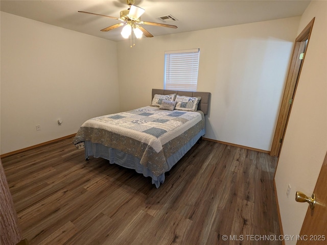1114 W 22nd St, Claremore, OK 74017 - bedroom with wood finished floors and a ceiling fan