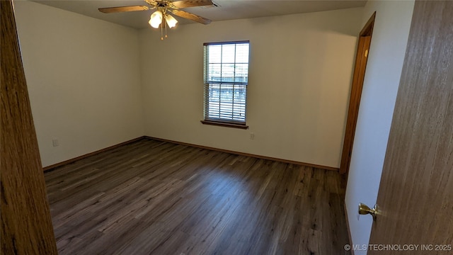 1114 W 22nd St, Claremore, OK 74017 - empty room with dark wood-type flooring and a ceiling fan