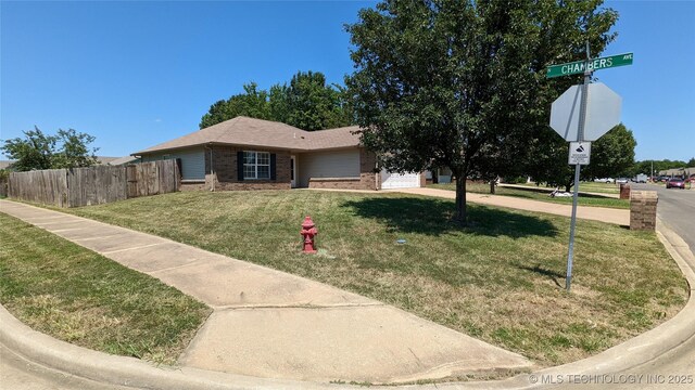 1114 W 22nd St, Claremore, OK 74017 - view of front of house with brick siding