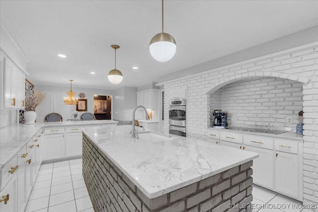 5824 S Louisville Ave, Tulsa, OK 74135 - kitchen featuring black electric cooktop, light tile patterned floors, stainless steel double oven, white cabinets, and crown molding