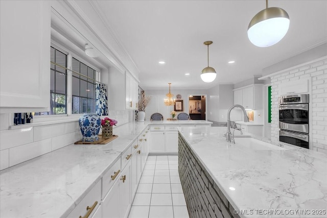 5824 S Louisville Ave, Tulsa, OK 74135 - kitchen with stainless steel double oven, backsplash, white cabinets, ornamental molding, and light stone countertops
