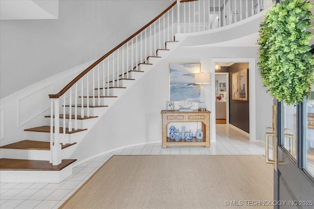 5824 S Louisville Ave, Tulsa, OK 74135 - stairway with tile patterned floors and a towering ceiling