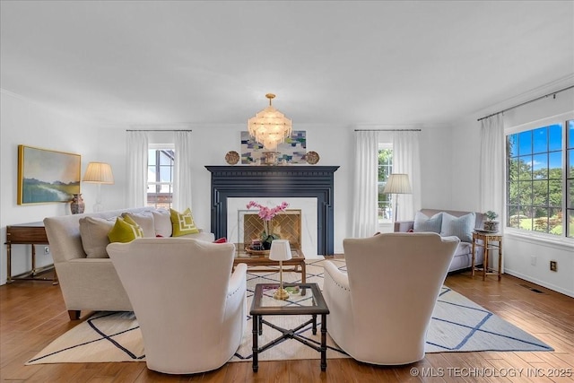 5824 S Louisville Ave, Tulsa, OK 74135 - living room featuring wood finished floors and a chandelier