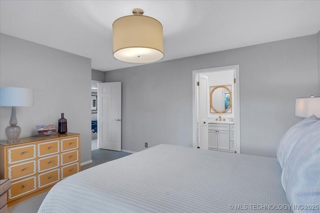 5824 S Louisville Ave, Tulsa, OK 74135 - bedroom with ensuite bath and a sink