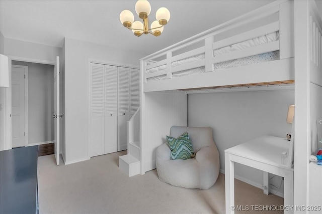 5824 S Louisville Ave, Tulsa, OK 74135 - bedroom with carpet, a chandelier, and a closet