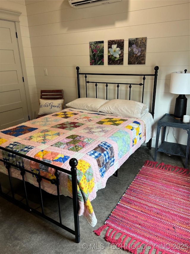 13425 SW 1025th Ave, Tuskahoma, OK 74571 - bedroom with a wall mounted AC and wood walls