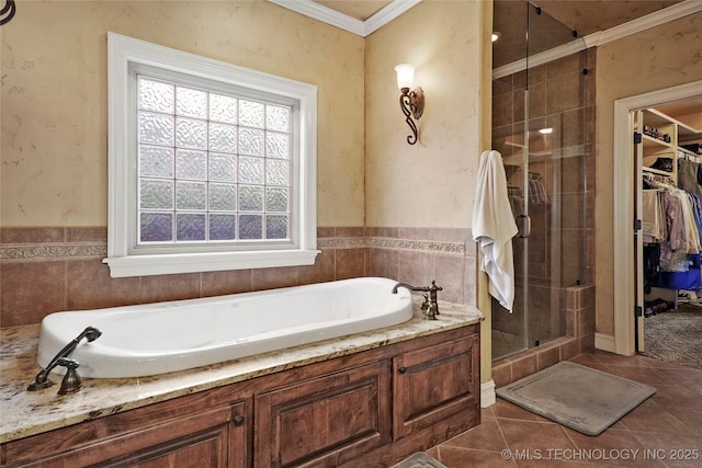 509 E Glendale St, Broken Arrow, OK 74011 - full bathroom with a bath, a shower stall, a walk in closet, tile patterned flooring, and crown molding