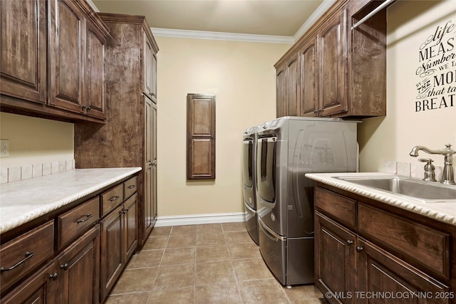 509 E Glendale St, Broken Arrow, OK 74011 - laundry area with cabinet space, independent washer and dryer, ornamental molding, and light tile patterned flooring