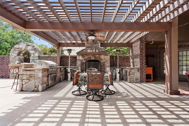 509 E Glendale St, Broken Arrow, OK 74011 - view of patio with an outdoor stone fireplace, an outdoor kitchen, a pergola, outdoor dining area, and a ceiling fan