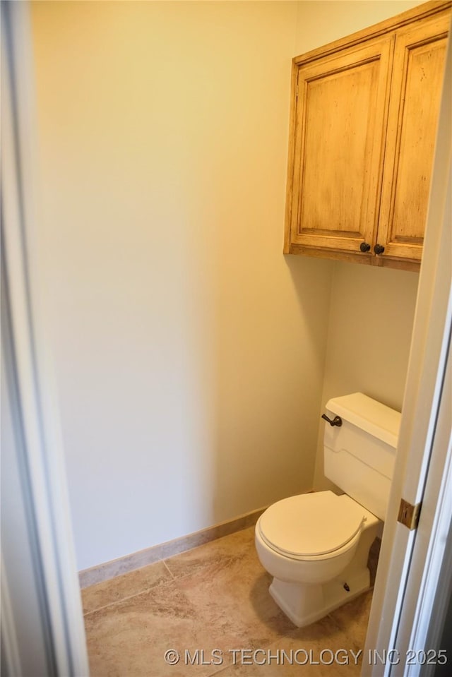 1207 E 21st Pl, Tulsa, OK 74114 - bathroom with toilet and baseboards