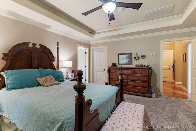 13559 E 463rd Rd, Claremore, OK 74017 - carpeted bedroom with a tray ceiling, crown molding, and ceiling fan