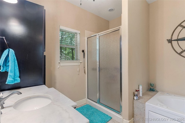 13559 E 463rd Rd, Claremore, OK 74017 - bathroom with a shower stall, a garden tub, and vanity