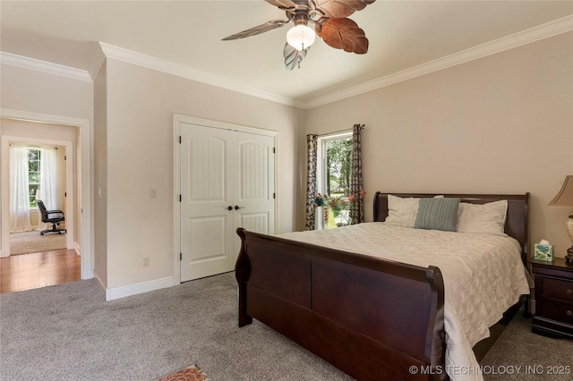 13559 E 463rd Rd, Claremore, OK 74017 - bedroom featuring carpet floors, multiple windows, ornamental molding, a ceiling fan, and a closet