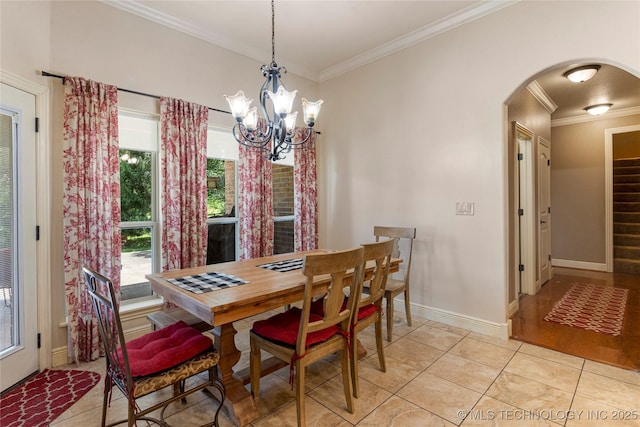 13559 E 463rd Rd, Claremore, OK 74017 - dining area with arched walkways, ornamental molding, light tile patterned flooring, and a chandelier
