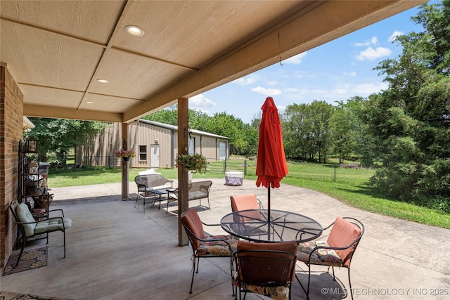 13559 E 463rd Rd, Claremore, OK 74017 - view of patio / terrace with outdoor dining space and view of scattered trees