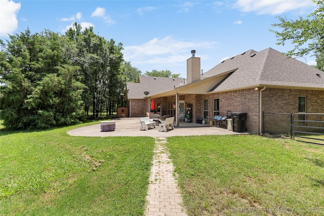 13559 E 463rd Rd, Claremore, OK 74017 - rear view of house featuring brick siding, a patio, roof with shingles, and a chimney