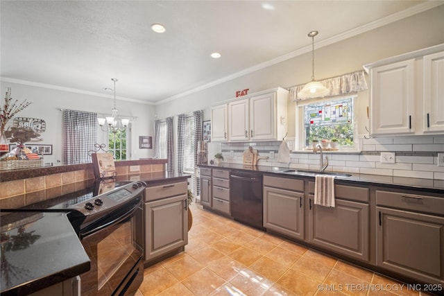 4005 Frontier Rd, Sapulpa, OK 74066 - kitchen with dishwasher, electric range, dark countertops, tasteful backsplash, and a chandelier