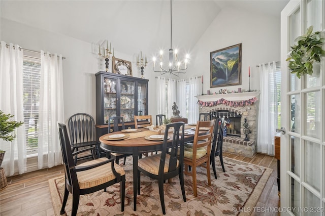 4005 Frontier Rd, Sapulpa, OK 74066 - dining space featuring a chandelier, lofted ceiling, light wood-style flooring, and plenty of natural light