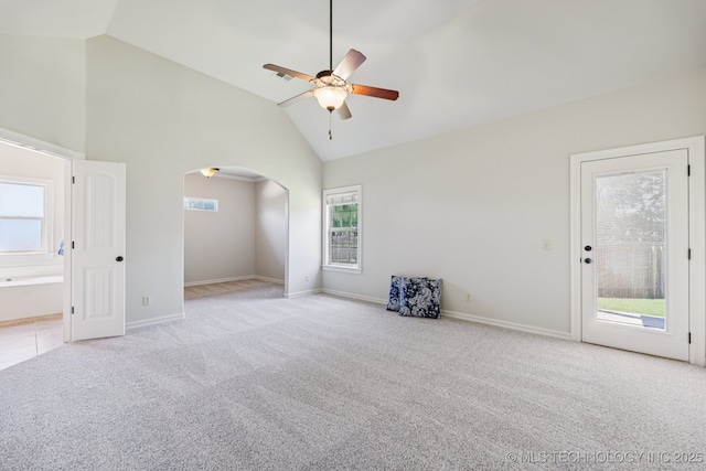 3604 W 109th St S, Jenks, OK 74037 - carpeted empty room with ceiling fan, arched walkways, and high vaulted ceiling
