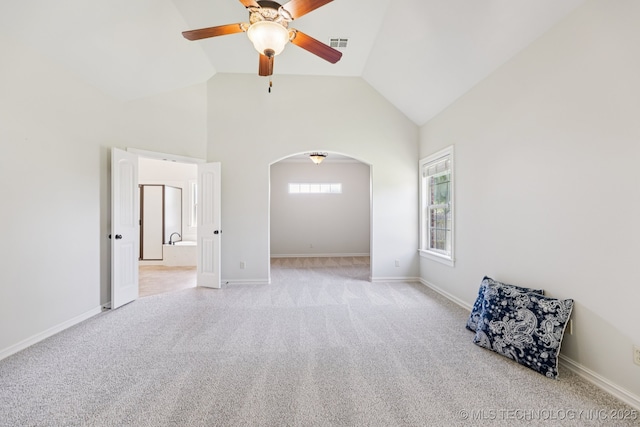 3604 W 109th St S, Jenks, OK 74037 - empty room with arched walkways, a ceiling fan, carpet floors, and high vaulted ceiling