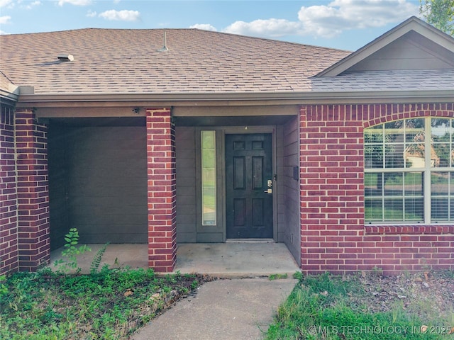 4728 S 196th Ave E, Broken Arrow, OK 74014 - property entrance featuring a shingled roof and brick siding