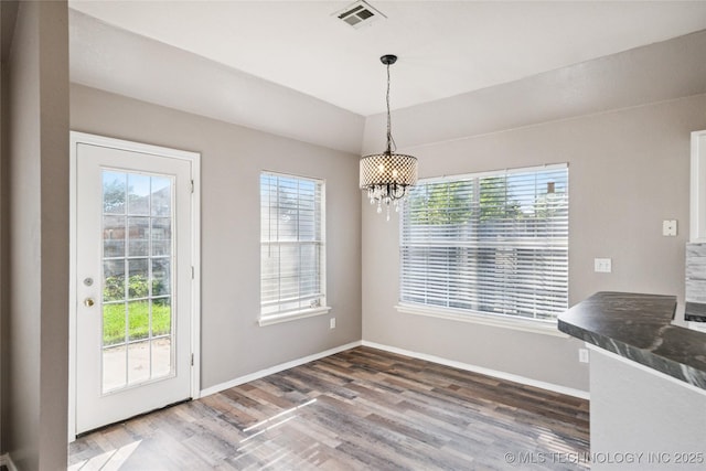 4728 S 196th Ave E, Broken Arrow, OK 74014 - unfurnished dining area featuring a chandelier and wood finished floors