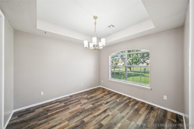 4728 S 196th Ave E, Broken Arrow, OK 74014 - spare room with a chandelier, a tray ceiling, and wood finished floors