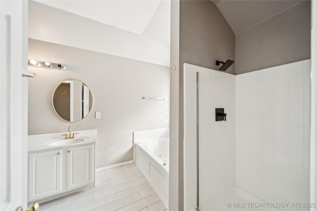 4728 S 196th Ave E, Broken Arrow, OK 74014 - bathroom with a walk in shower, a bath, vanity, and vaulted ceiling