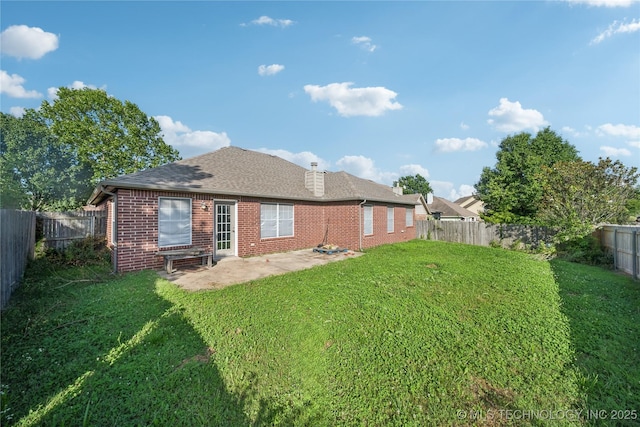 4728 S 196th Ave E, Broken Arrow, OK 74014 - rear view of property with brick siding, a fenced backyard, a patio, a shingled roof, and a chimney