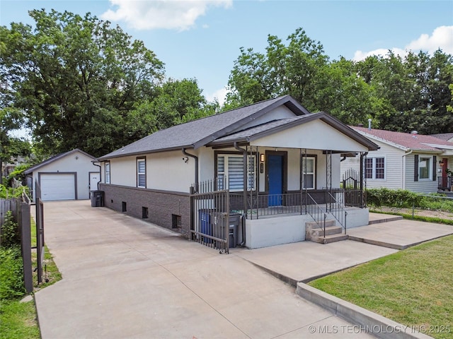 241 S Richmond Ave, Tulsa, OK 74112 - single story home with covered porch, concrete driveway, a garage, stucco siding, and an outdoor structure