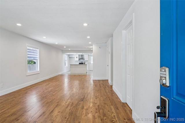 241 S Richmond Ave, Tulsa, OK 74112 - unfurnished living room featuring wood finished floors and recessed lighting
