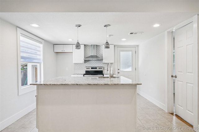 241 S Richmond Ave, Tulsa, OK 74112 - kitchen featuring wall chimney range hood, stainless steel electric range oven, light tile patterned floors, white cabinets, and recessed lighting